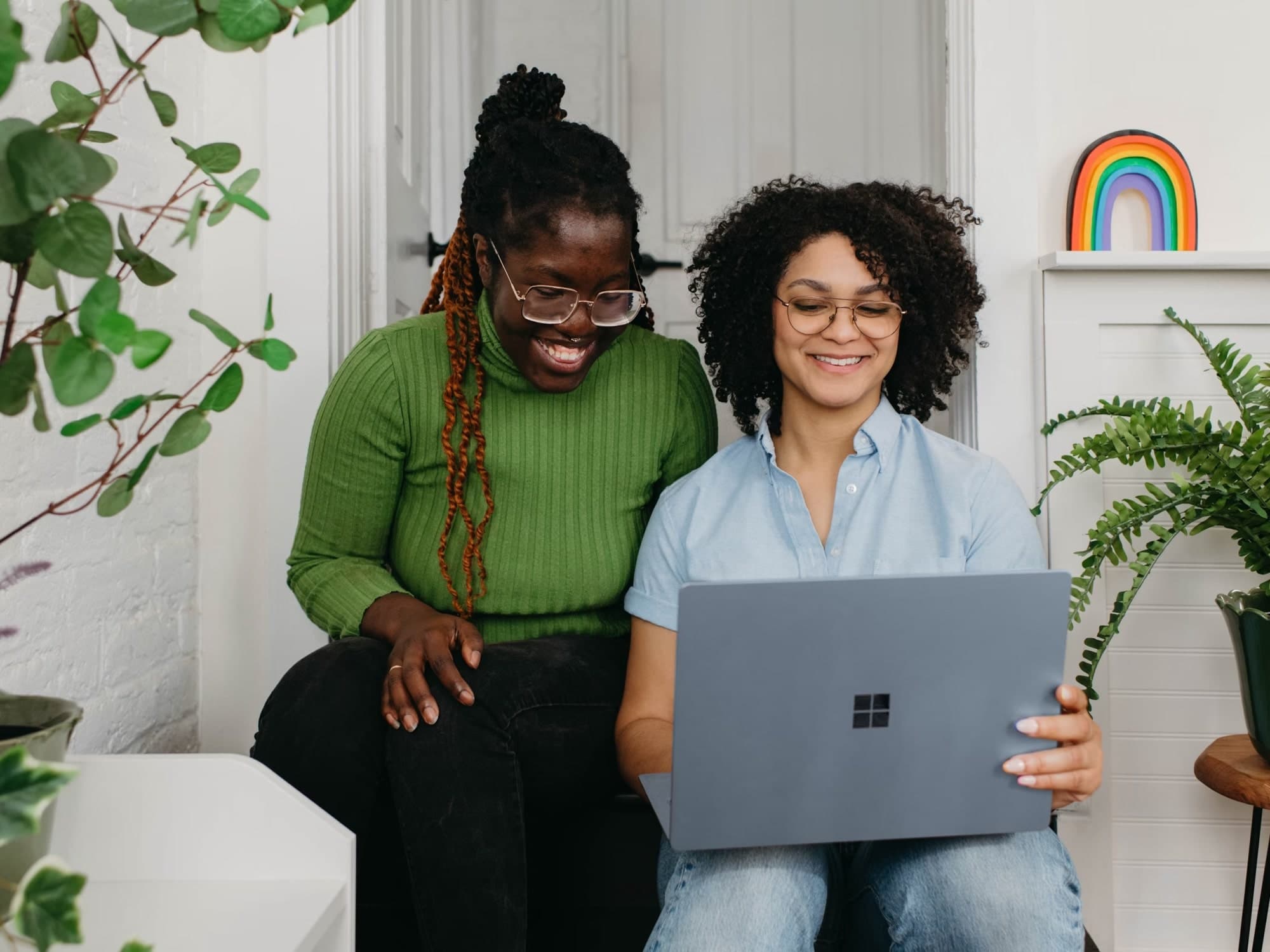 Small business owners using YourSend on a laptop